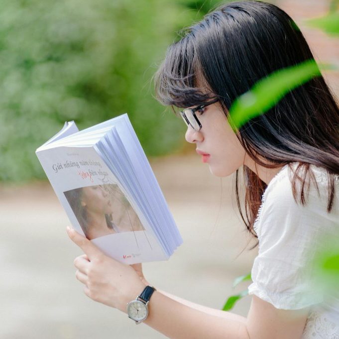 Girl reading a book.